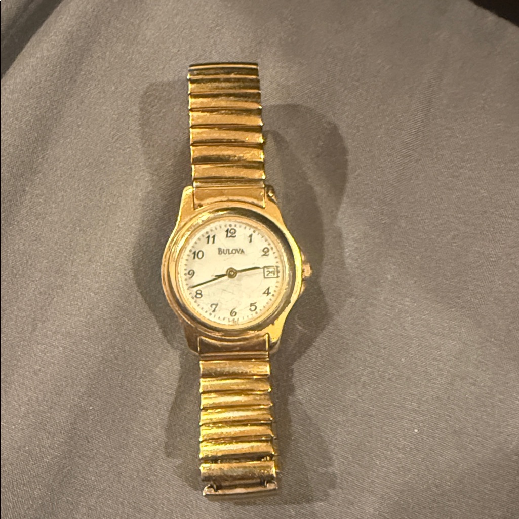 Bulova Gold Timepiece With White Dial